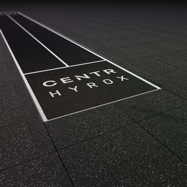 A render of how the Centr x HYROX Competition Turf looks when inserted and surrounded by gym flooring