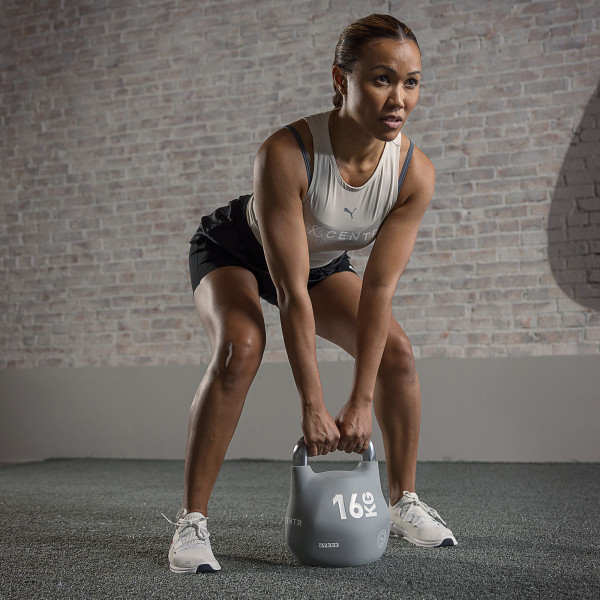 Lifestyle image of a model using the 16kg CENTR x HYROX Competition Octo Kettlebell