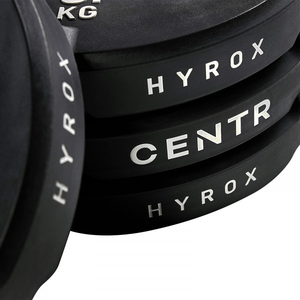 Stack of CENTR x HYROX Bumper Plates showing side branding.