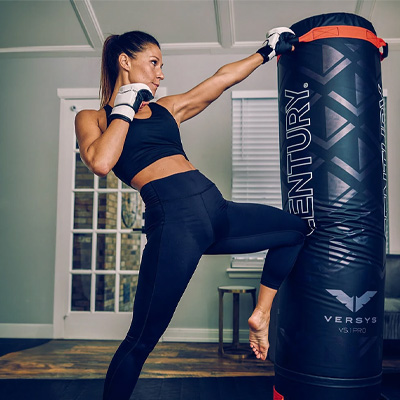 Image of a model grabbing and knee striking the Century Versys VS.1 PRO