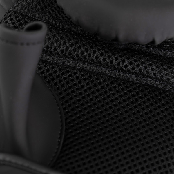 Closeup of the mesh palm on the Century Brave Oversize Bag Gloves in black and silver