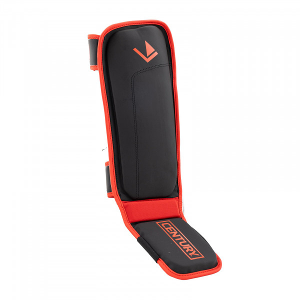 Angled padded view of the Century Brave Shin Instep Guards in black and red