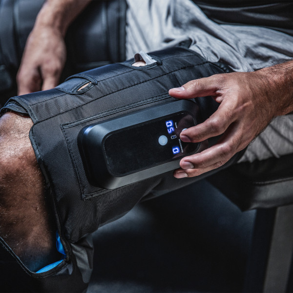 Lifestyle image of the Compex Ayre Compression Boots - close up of the console