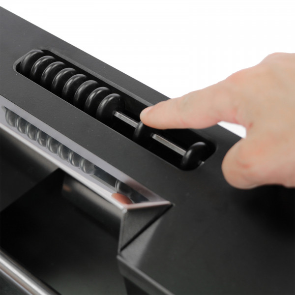 Close-up of the scoring beads on the black Cornilleau Play-Style Origin outdoor football table