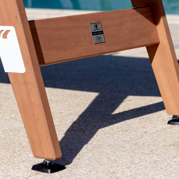 Close-up of wooden leg with branding on the Cornilleau Play-Style Origin outdoor football table in white