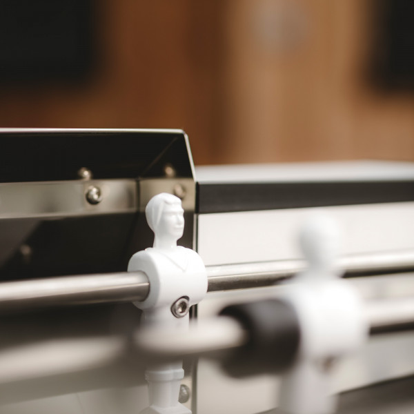 Close-up of white player figure on the Cornilleau Play-Style Origin outdoor football table in white