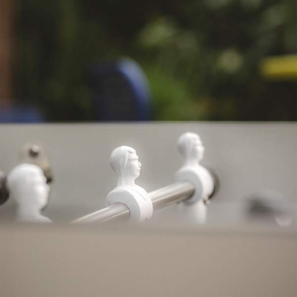 Close-up of player figures on the Cornilleau Play-Style Origin outdoor football table in white
