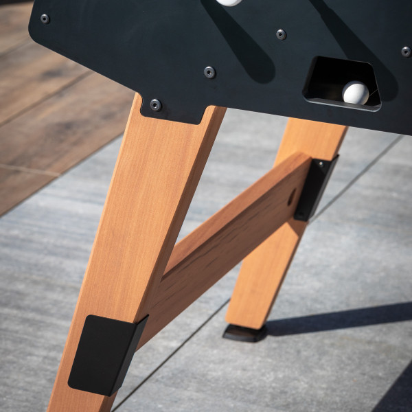 Close-up of wooden leg on the Cornilleau Play-Style Origin outdoor duo football table in black