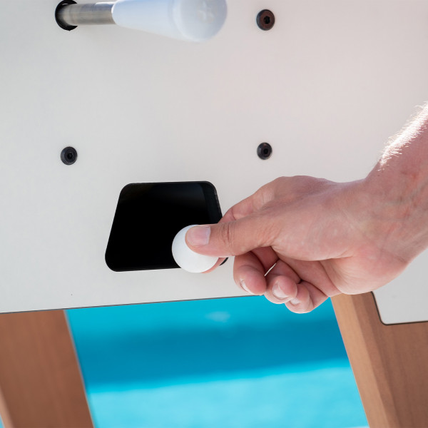 Plastic ball retrieval on the white Cornilleau Play-Style Origin outdoor duo football table