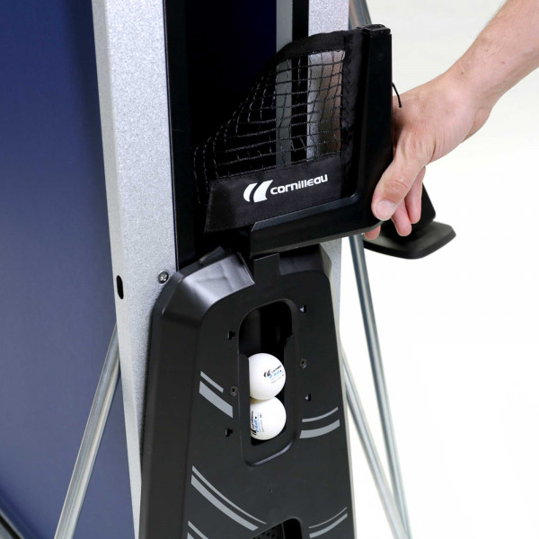 Hand folding net on the Cornilleau Sport 400 Indoor Table Tennis Table for storage