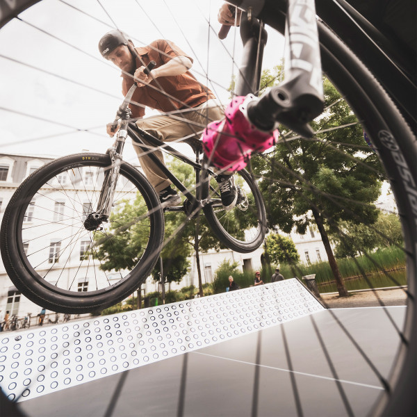 BMX trick being performed over the Cornilleau Urban Outdoor Table Tennis Table