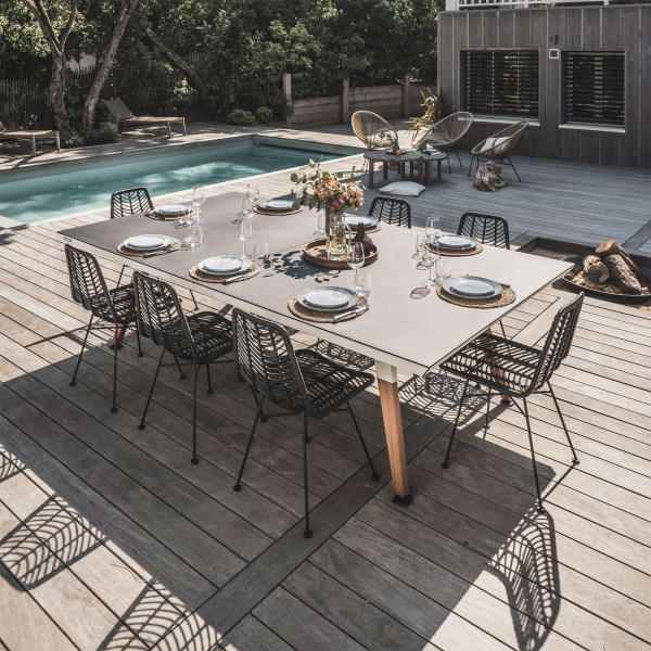 White Cornilleau Play-Style Origin table set for outdoor dining by the pool