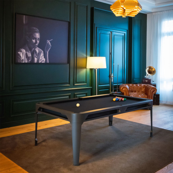 Pool game setup on the Cornilleau Play-Style Hyphen with black frame and dark grey cloth