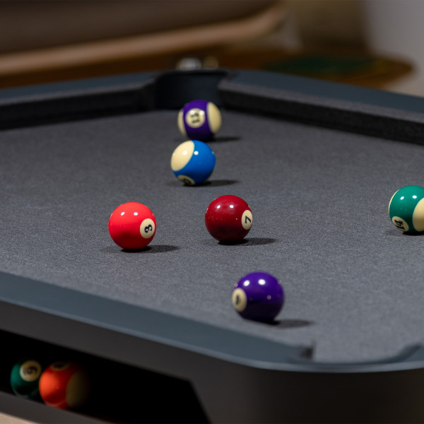 Close-up of American pool balls on the Cornilleau Play-Style Hyphen table with black frame and light grey cloth