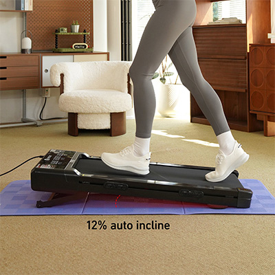 Model walking on the DeerRun Z10 Smart Auto Incline Walking Pad at 12% auto incline 