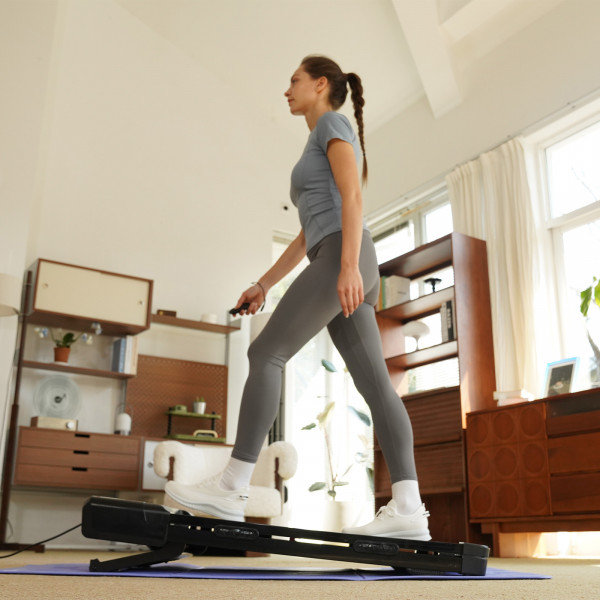 Model walking on an incline with the DeerRun Z10 Smart Auto Incline Walking Pad