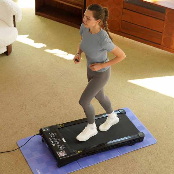 Overhead view of a model exercising on the DeerRun Z10 Smart Auto Incline Walking Pad