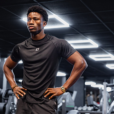 image of a model standing in a gym