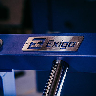 A close-up of a custom, blue Exigo machine