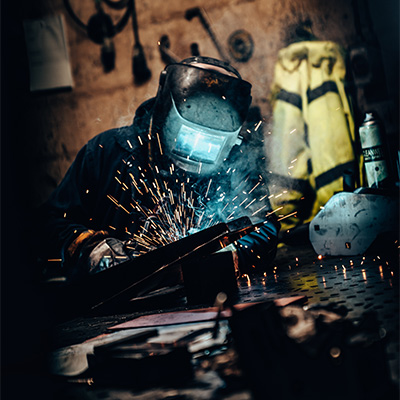 Image of an Exigo engineer welding