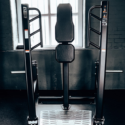 Image of the Exigo Plate Loaded 2.0 ISO Standing Press in a gym setting