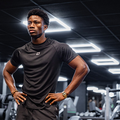 Image of a model standing in a gym