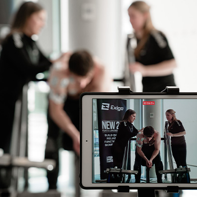 Image of sports scientists monitoring an Exigo athlete