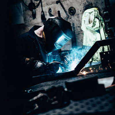 Image of a welder with a blow torch