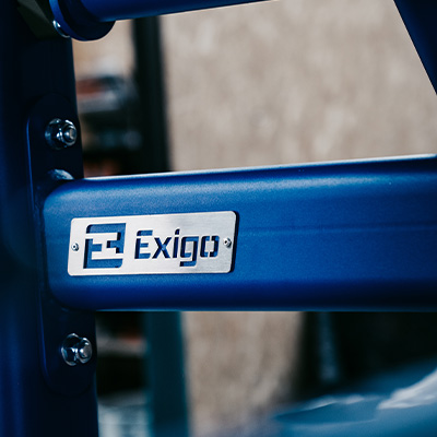 A close up of an Exigo machine in custom blue style