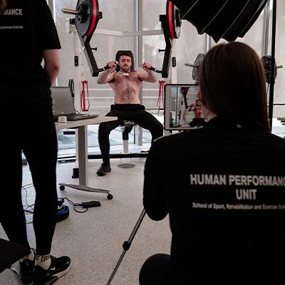 Image of a model performing testing on an Exigo machine