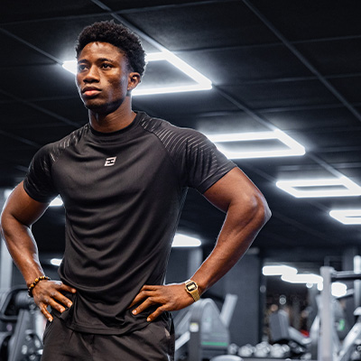 Image of a model standing in a gym
