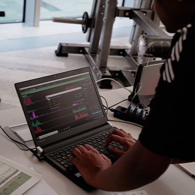 Image of an exercise scientist looking at data