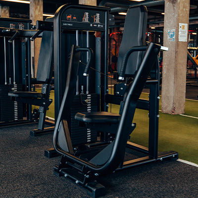 Photograph of the Exigo Chest Press in a gym