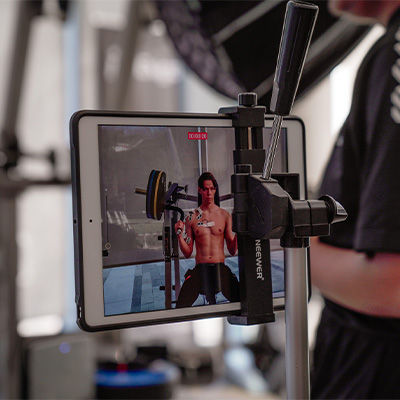 Photograph of a tablet recording a model having their biometrics tested. 