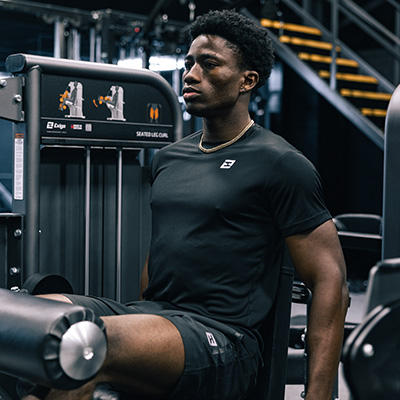 Image of a model using the Exigo Seated Leg Curl