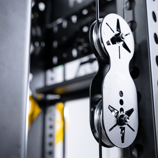 Close-up of dual pulley system on Force USA C20 Trainer