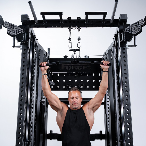 User performing lat pulldown on Force USA C20 Trainer
