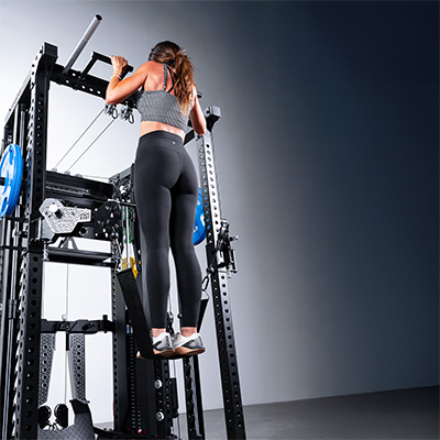 User performing pull-up on Force USA C20 Trainer