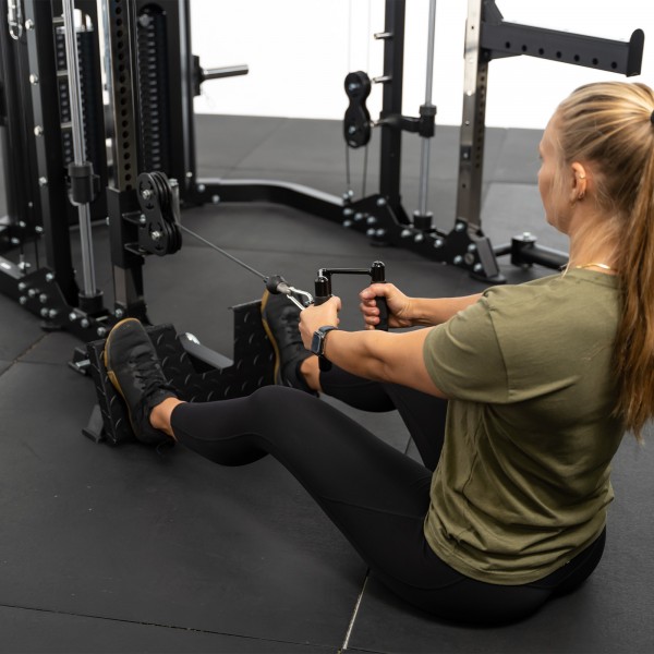 User performing a seated cable row on the Force USA G12 V2 All-In-One Trainer.
