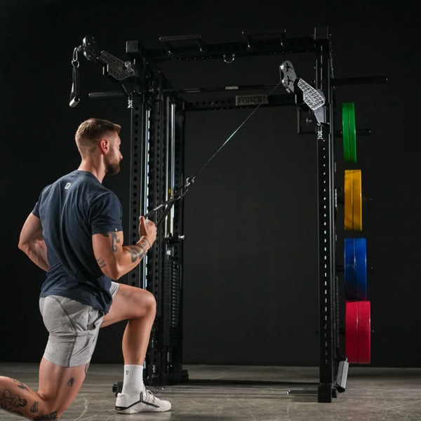 Lifestyle image of the Force USA M20 All-In-One Trainer - Image of a model performing a cable row