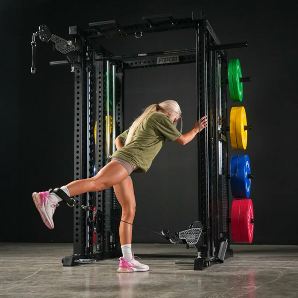 Lifestyle image of the Force USA M20 All-In-One Trainer - Image of a model performing a cable kickback