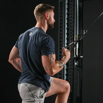 Image of a model performing a cable row on the Force USA M20