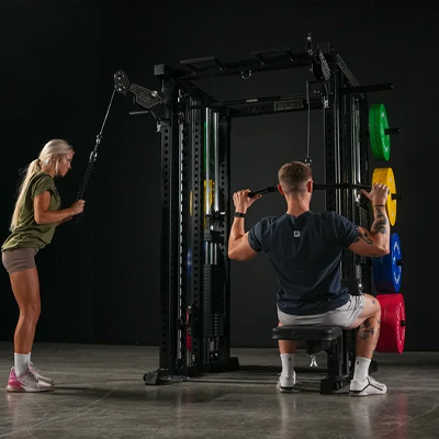 Image of two models training on the Force USA M20