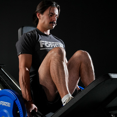 Image of a model using the Force USA Compact Leg Press & Hack Squat as a leg press