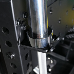 A lifestyle image showing a barbell held in the Force USA Barbell Holder