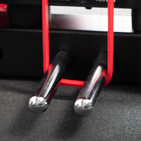 Lifestyle image for the Force USA Magpins attached to a machine with a resistance band attached.