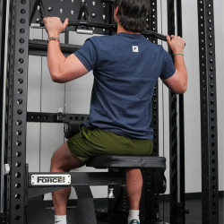 User performing lat pulldown on the Force USA Swivel Seat (rear view)
