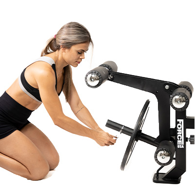 Template image of the Force USA MyBench V2 with a model attaching a weight plate