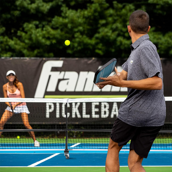 Players using the Franklin Pickleball Official Net during a match