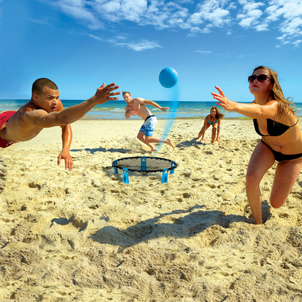 Four players competing in Spyderball on sand